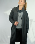 Woman wearing long charcoal cardigan