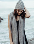 Woman wearing alpaca beanie at beach