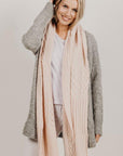 Woman wearing a pink Alpaca Patch Scarf