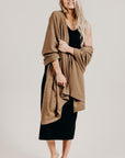 Woman wearing a light brown Classic Cervelt Scarf - Kapeka NZ, Made from New Zealand Red Deer Fibre. Very Soft and rare Fibre. Only made in New Zealand