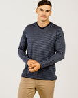 Man wearing a Striped Merino V Neck Long Sleeve T-Shirt - Kapeka NZ