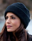 Woman wearing a navy merinosilk ribbed hat