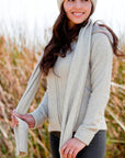 Woman wearing a lichen Merinosilk Fine-Ribbed Scarf - Kapeka NZ