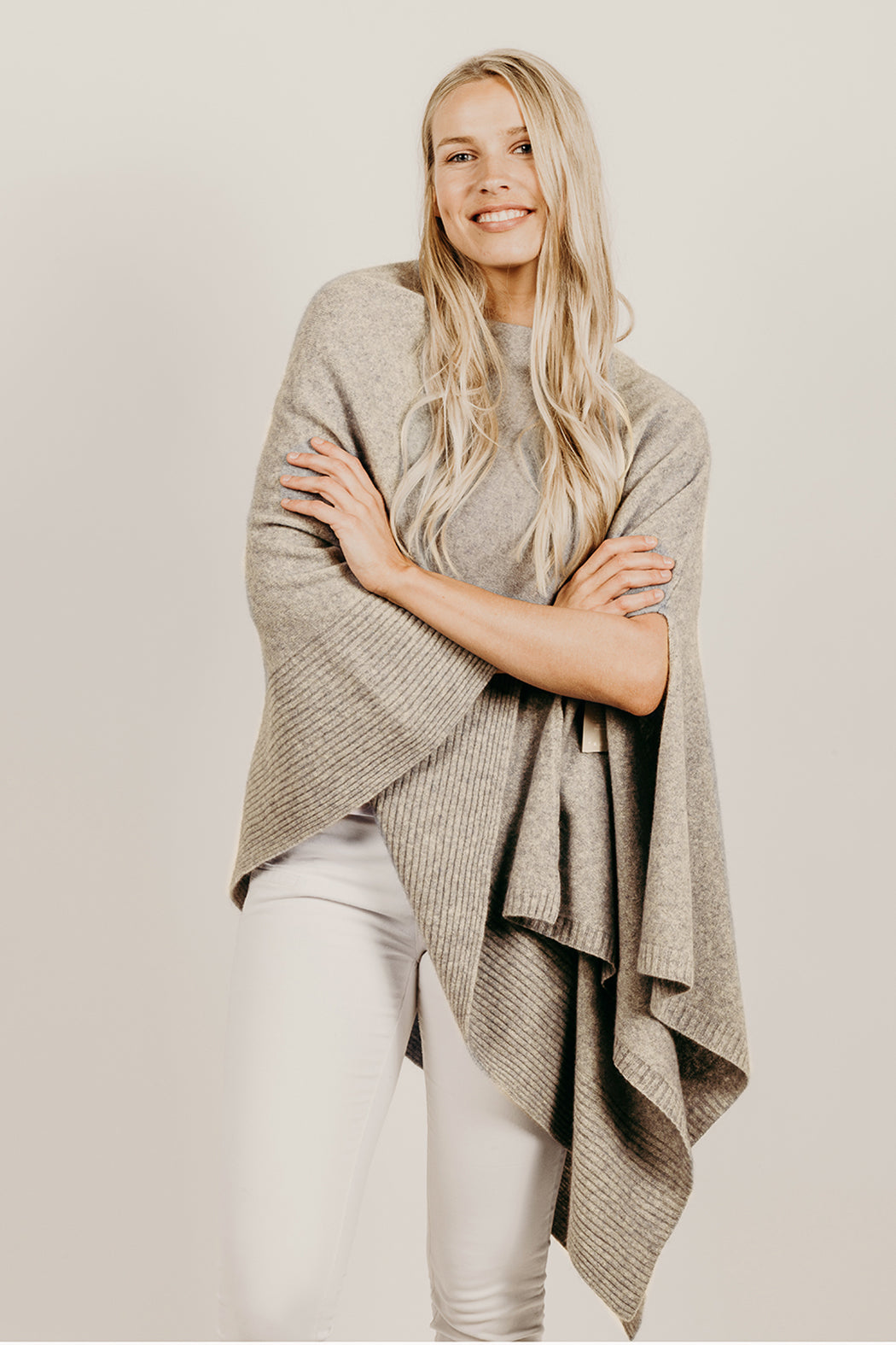 Woman wearing a lichen wrap poncho