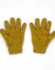 Pair of mustard yellow gloves on a white background