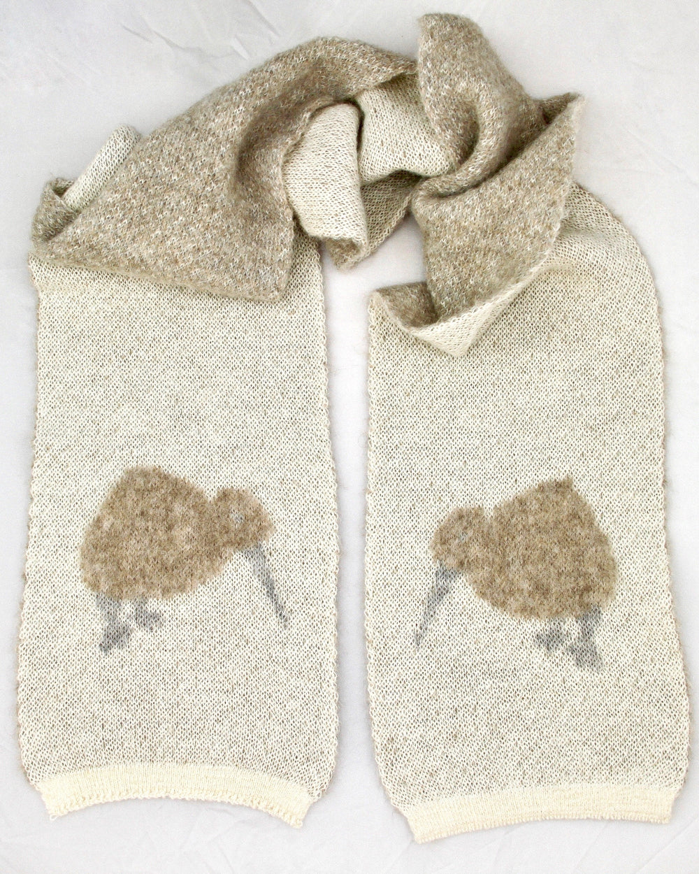 Knitted scarf with kiwi bird pattern on a white background